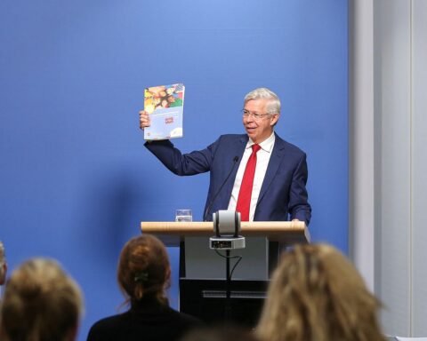 Grafik mit Kindern, Ärzten und gesundheitlichen Symbolen, die Mitbestimmung im Gesundheitswesen darstellen.