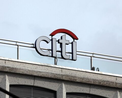 Citi-Bank-Logo mit Fokus auf KI-Boom, Börsenkurse und Marktexpertisen im Hintergrund.