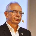 Michael Vassiliadis kritisiert Bundesregierung für Kommunikationsprobleme und fordert stärkere Zusammenarbeit mit Bevölkerung.