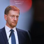 Michael Kretschmer, Sachsen, warnt vor AfD-Macht, Brandmauer als Metapher für politische Sicherheit.
