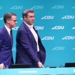 Markus Söder und Carsten Linnemann bei der Spargelfahrt der SPD, Symbol für politische Zusammenarbeit.